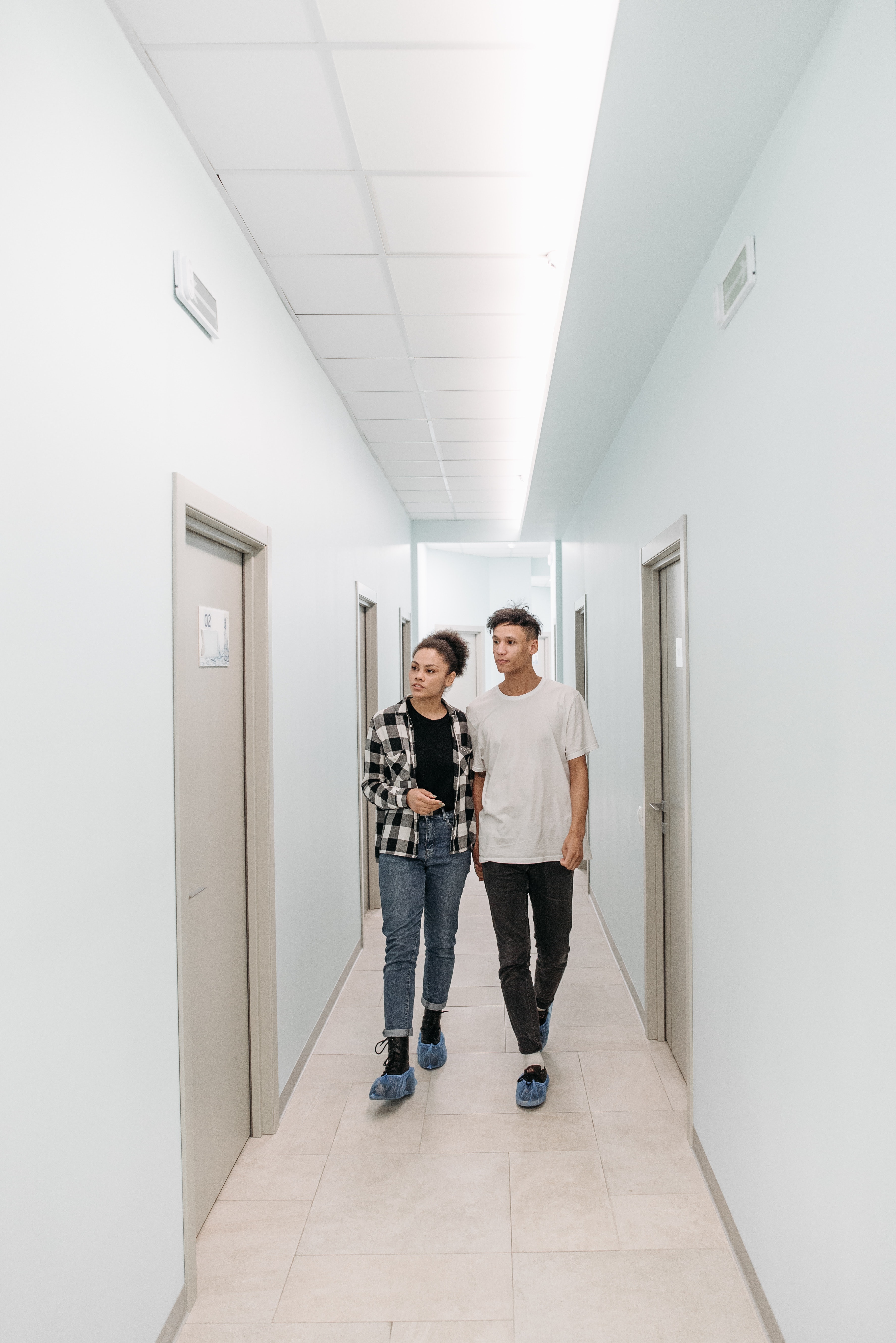 young couple walking to examination room